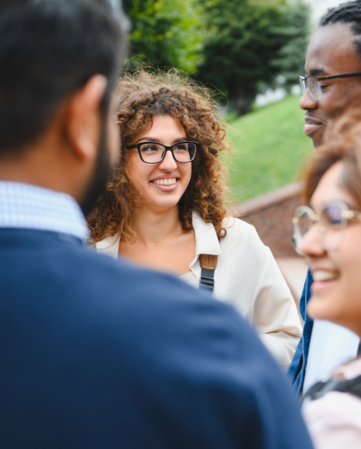 diverse-university-students-talking-outdoors-shar-2026-01-11-08-58-44-utc